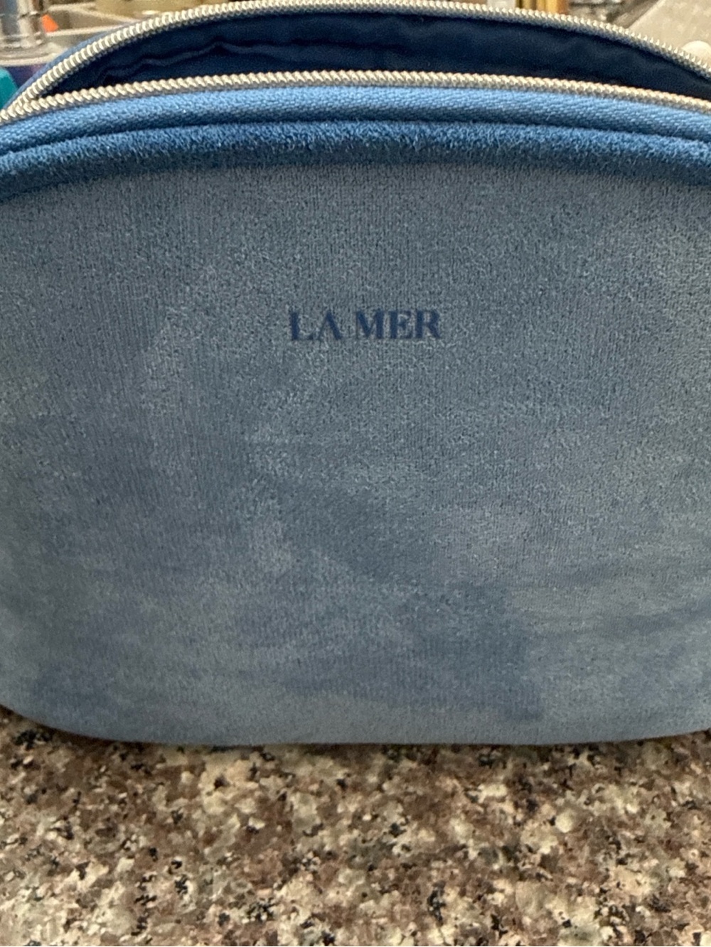 La Mer Navy Cosmetic Pouch with Gold Zip Accent